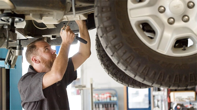 Auto Super Shoppes mechanic servicing a car