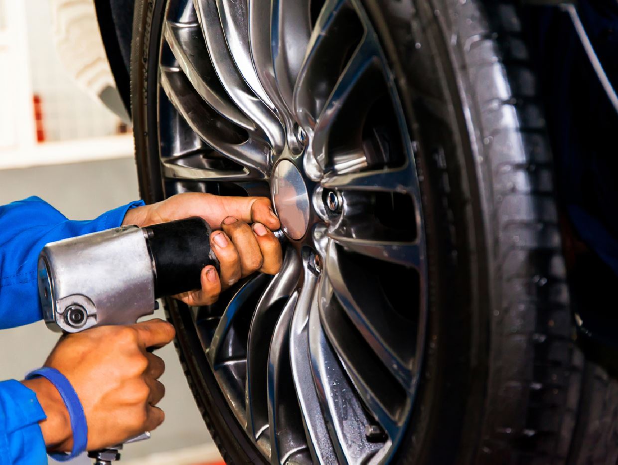 Auto Super Shoppes technician fitting a new car tyre